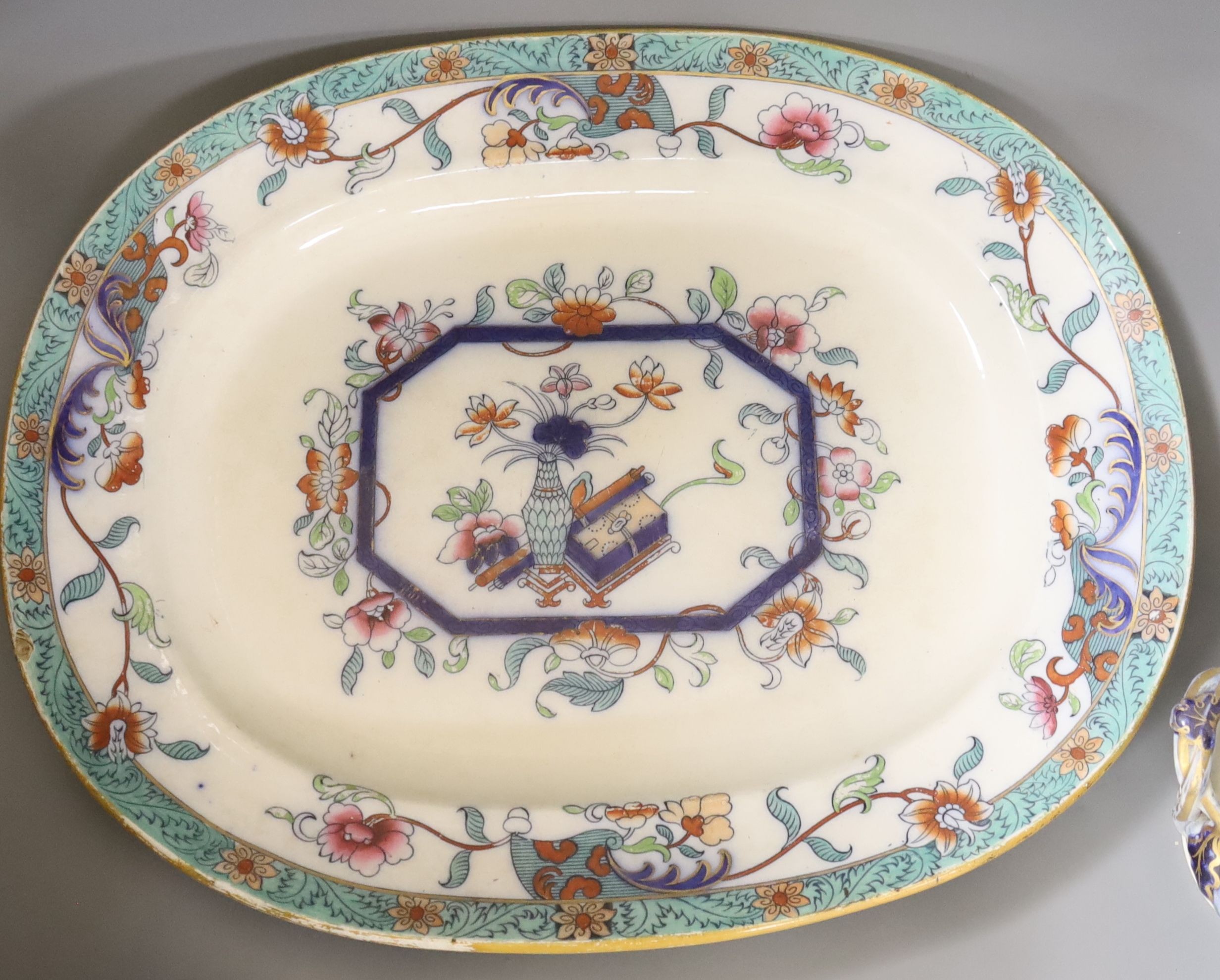 A mid 19th century Staffordshire pottery lidded soup tureen and cover (base cracked), a large meat dish and a sauce tureen (lacking lid) (3)